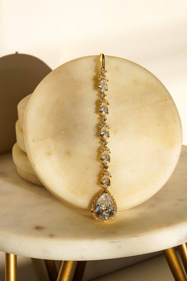 Nila Diamanté Accent Golden AD Maang Tikka - Gold-plated with teardrop stones and diamante accents, available in gold & multicolor or gold & white.