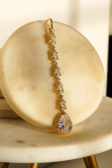 Nila Diamanté Accent Golden AD Maang Tikka - Gold-plated with teardrop stones and diamante accents, available in gold & multicolor or gold & white.