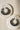 Pair of Noor Chandbali Hoop Earrings in silver-tone with black beads, styled on marble for South Asian elegance.