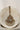 Pendant from Rimmie Artisan Crafted Choker Set with central zircon stone and pearl fringe, displayed on marble background.