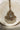 Close-up of Rimmie Artisan Crafted pendant with central zircon stone and pearl fringe, part of Pakistani choker set.