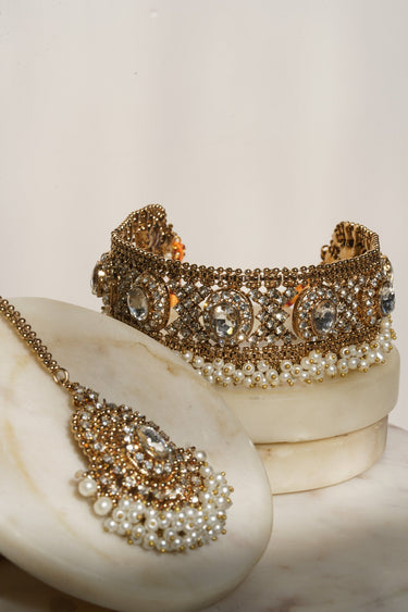 Pink zircon Rimmie Artisan Crafted Choker Set with pendant, styled on marble for Pakistani jewelry e-commerce display.