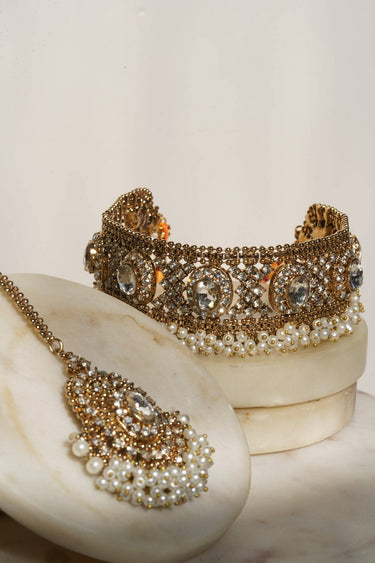 Pink zircon Rimmie Artisan Crafted Choker Set with pendant, styled on marble for Pakistani jewelry e-commerce display.