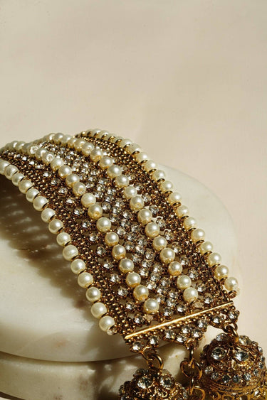 Detailed view of Samia Bangles with layered pearl and CZ stone rows, showcasing artisan-crafted elegance in gold finish.