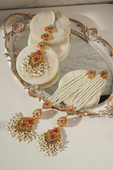 Pearl and gemstone Sanjana Earrings and Maang Tikka Set with gold detailing, ideal for traditional Indian and Pakistani attire.