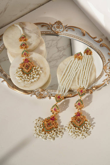 Sanjana Earrings and Maang Tikka Set in white pearls with colorful embellishments, showcasing intricate craftsmanship and regal charm.