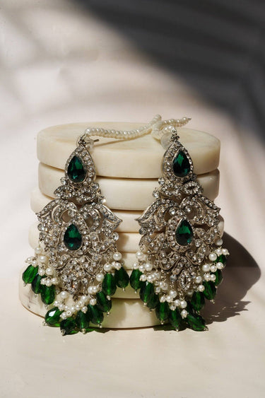 Sidra Dangler Earrings in silver with green gemstone accents and pearl drops, showcasing Pakistani Jewelry craftsmanship in a chandelier style.