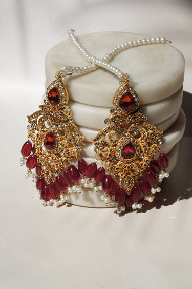 Pair of Sidra Dangler Earrings in antique gold with red stones and pearl accents, oversized chandelier design under $100.
