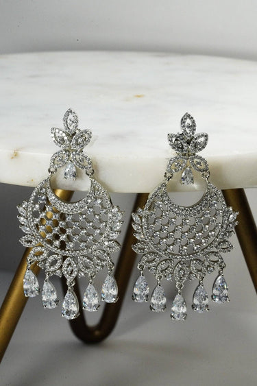 Siya AD Chandbali Earrings - Available in rhodium or gold plating with white AD stones, featuring a 2.5-inch drop, perfect for a statement piece.