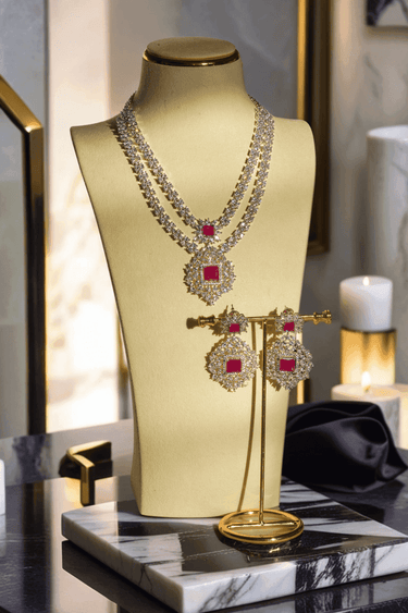 Zeenat Double Layer Diamanté Accent Necklace Set - Rhodium-plated silver finish with intricate detail-cut stones, available in four colors: sapphire blue, emerald green, white, and ruby. Includes matching statement earrings.