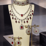 Priya Diamante Bridal Set - Rhodium-plated silver with maroon accents, including cascading necklace and intricate floral choker with matching earrings.