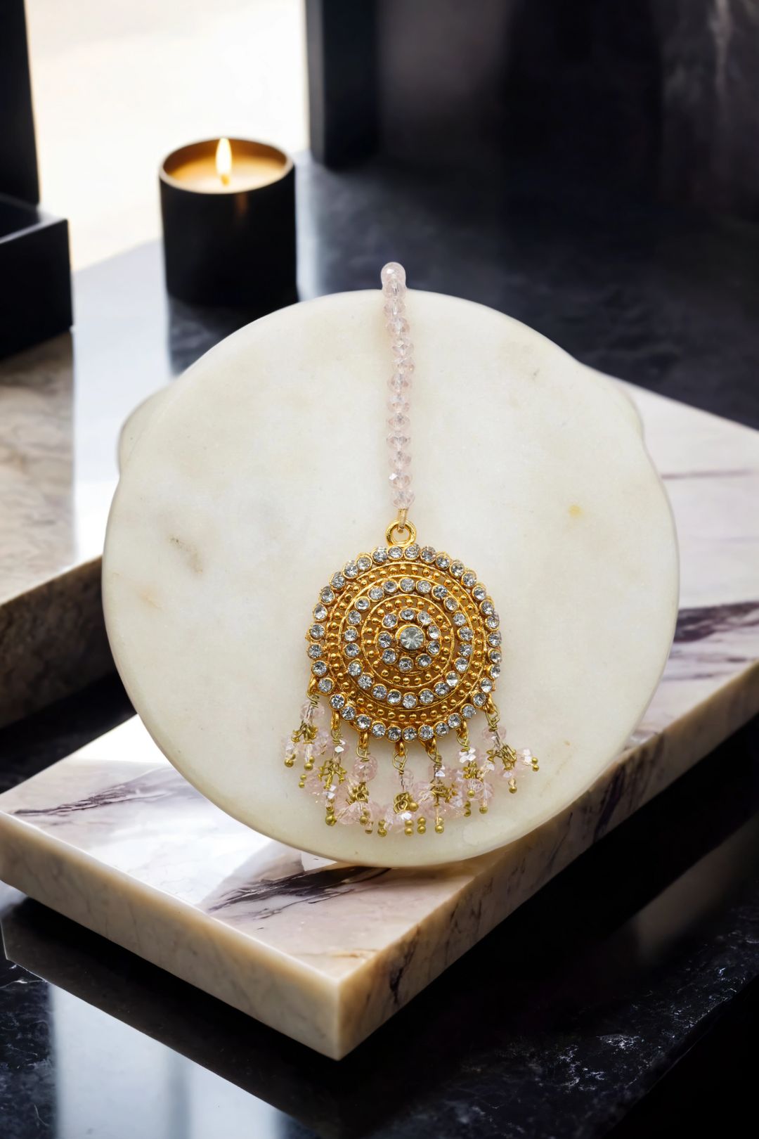 Gold Tabiha Maang Tikka with pink and gold bead fringe, a delicate addition to the handcrafted jewelry set.