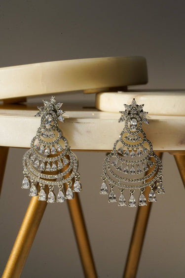 Sparkling chandelier earrings in rhodium finish with AD stones and teardrop dangles, perfect for minimalist jewelry lovers.