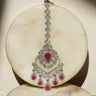 Oversized Rhodium plated American Diamond Maang Tikka with ruby pink and green teardrop dangles