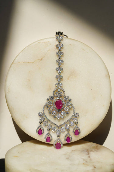 Oversized Rhodium plated American Diamond Maang Tikka with ruby pink and green teardrop dangles