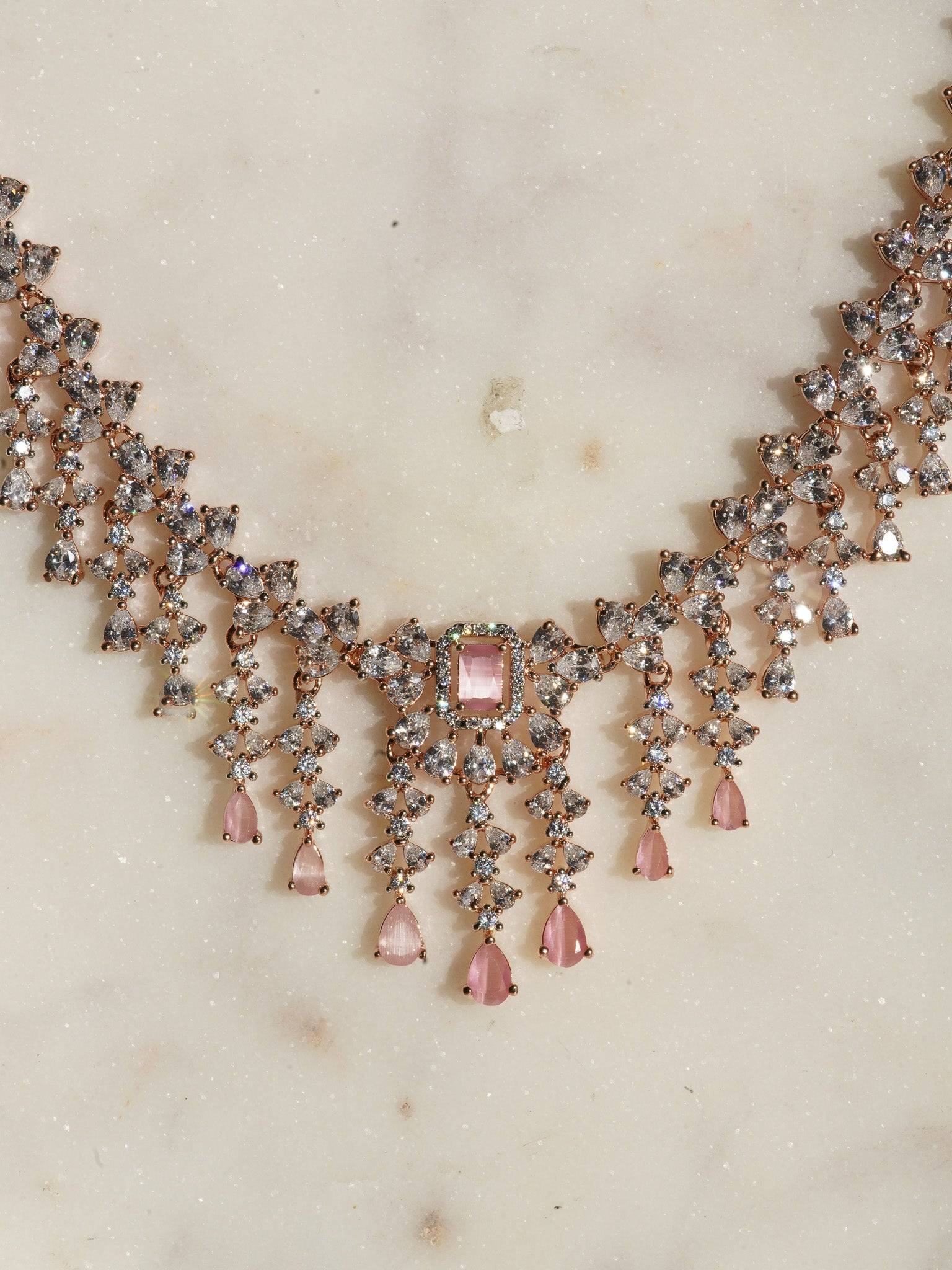 Anne Diamante Accent AD Necklace Set - Rose gold plated with cascading design, featuring diamante accent AD stones and matching dainty earrings, available in rose gold & white, rose gold & pink, rose gold & green, rose gold & sapphire blue, and rose gold & maroon.