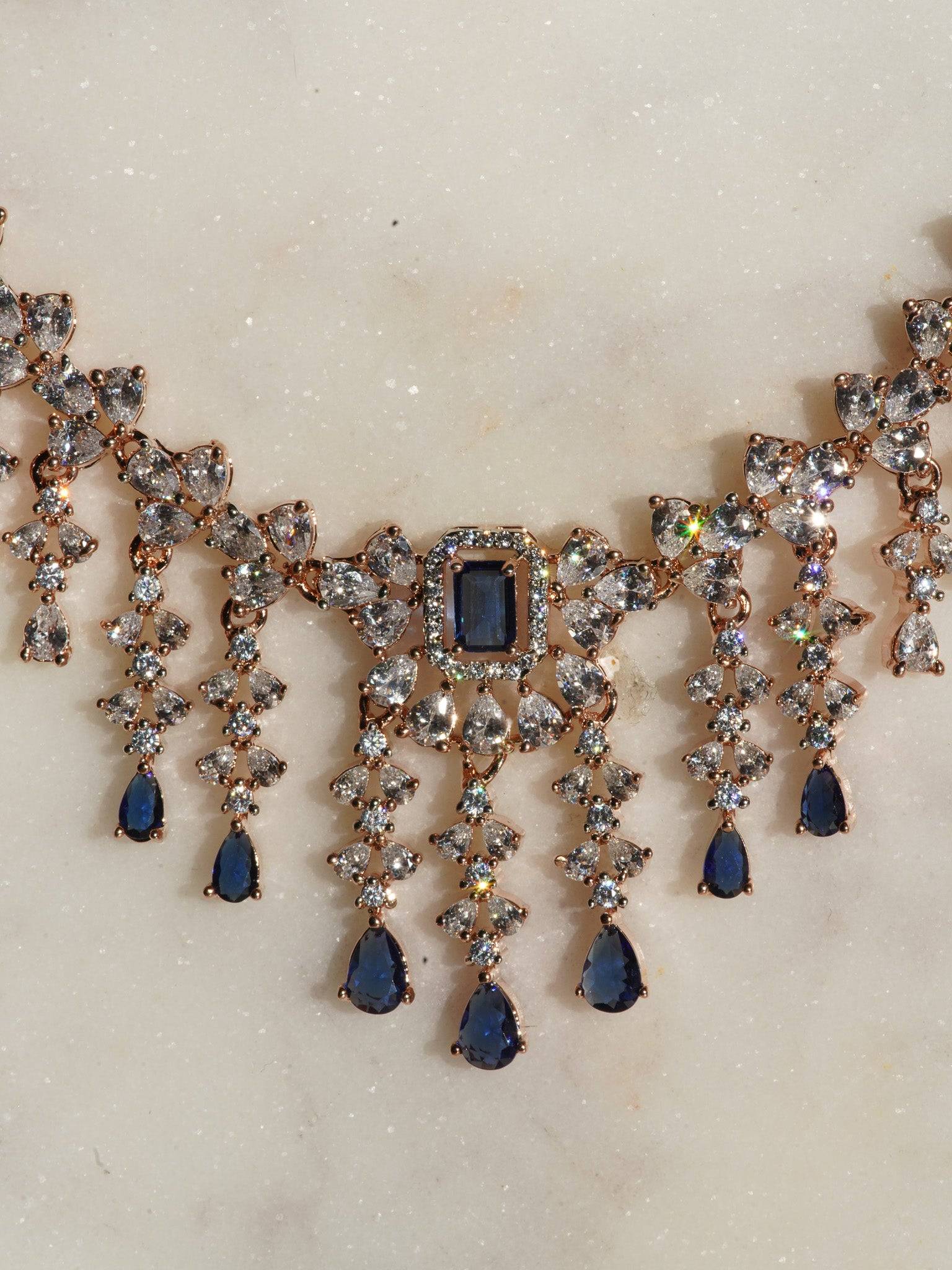 Anne Diamante Accent AD Necklace Set - Rose gold plated with cascading design, featuring diamante accent AD stones and matching dainty earrings, available in rose gold & white, rose gold & pink, rose gold & green, rose gold & sapphire blue, and rose gold & maroon.