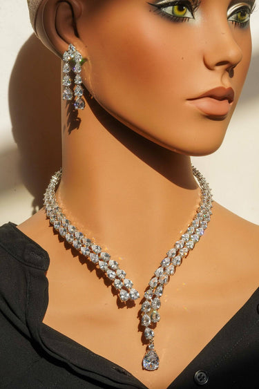 Brishti rhodium-plated necklace set with white teardrop diamante stones and Bvlgari-inspired openwork detail