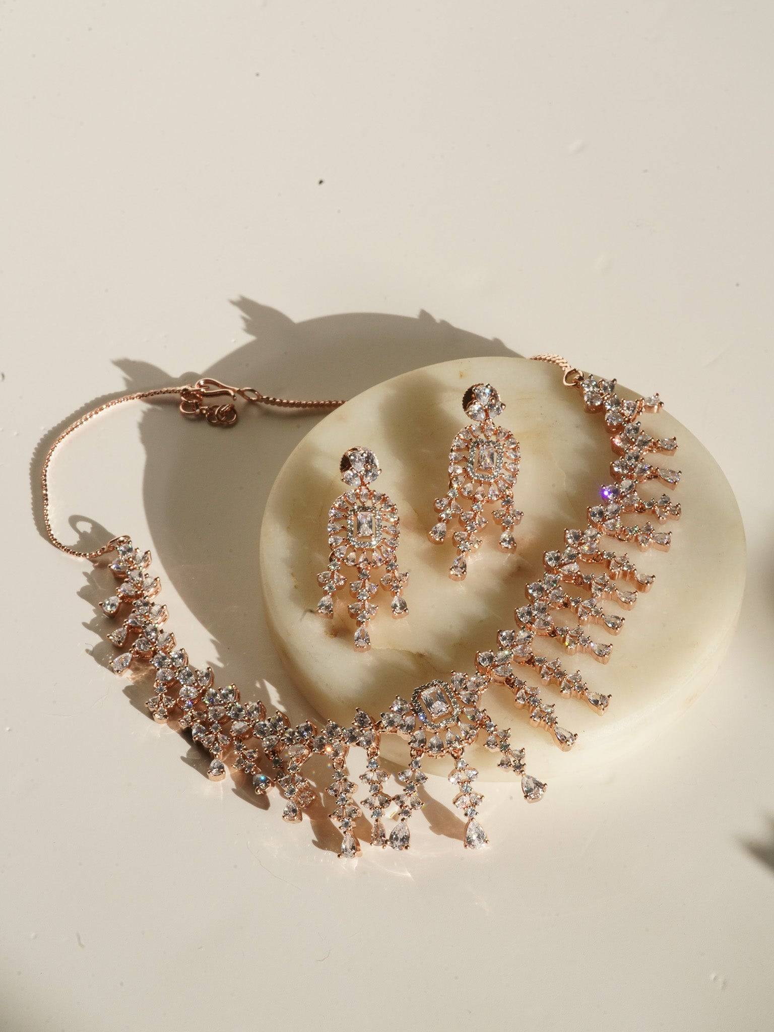 Anne Diamante Accent AD Necklace Set - Rose gold plated with cascading design, featuring diamante accent AD stones and matching dainty earrings, available in rose gold & white, rose gold & pink, rose gold & green, rose gold & sapphire blue, and rose gold & maroon.