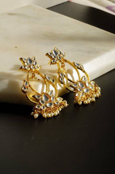 Stylish gold plated Kundan earrings adorned with faux pearls