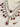 Priya Diamante Bridal Set - Rhodium-plated silver with maroon accents, including cascading necklace and intricate floral choker with matching earrings.
