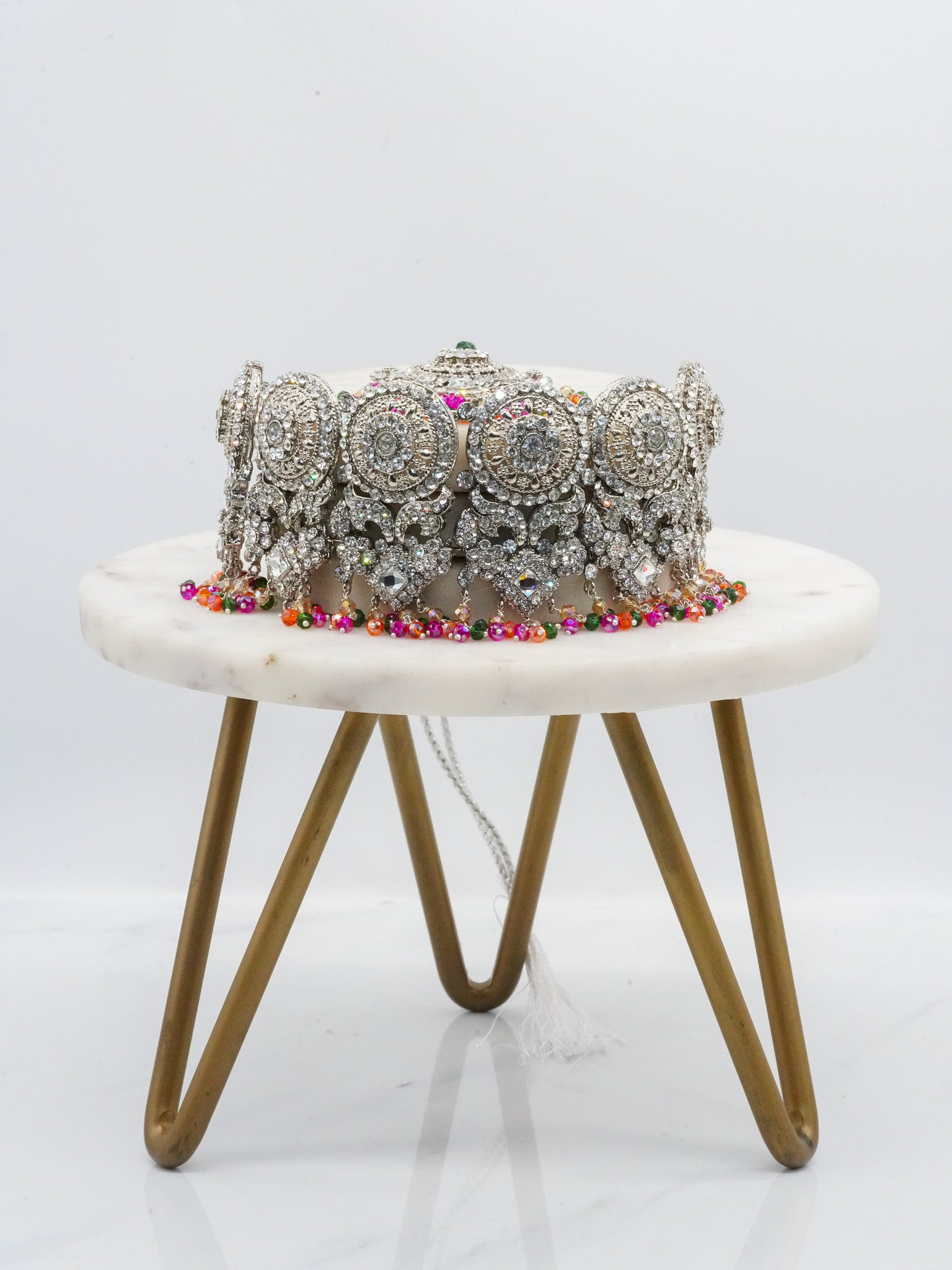 Silver Namar Choker Necklace Set with multicolor beads displayed on marble stand, ideal for festive wear.