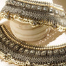Soha artisan crafted bridal statement ankle set for Desi brides in silver and pearl with white stones