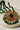Close-up of Ira - Chandbali pendant in green bead variant, featuring gold-tone craftsmanship and green crystal bead fringe.