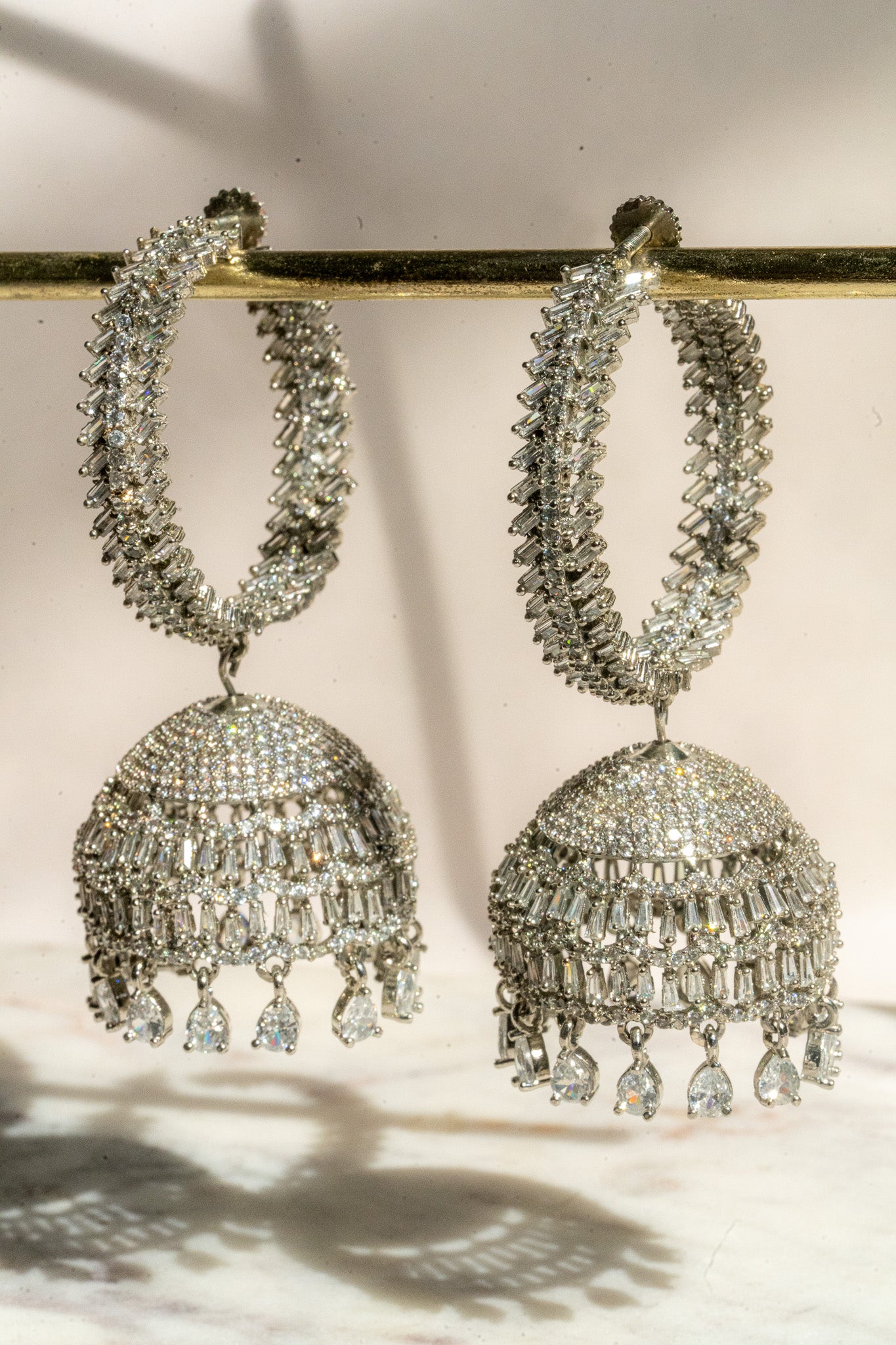 Elham - Rhodium Plated Hoop Style Dangling AD Jhumka Earrings