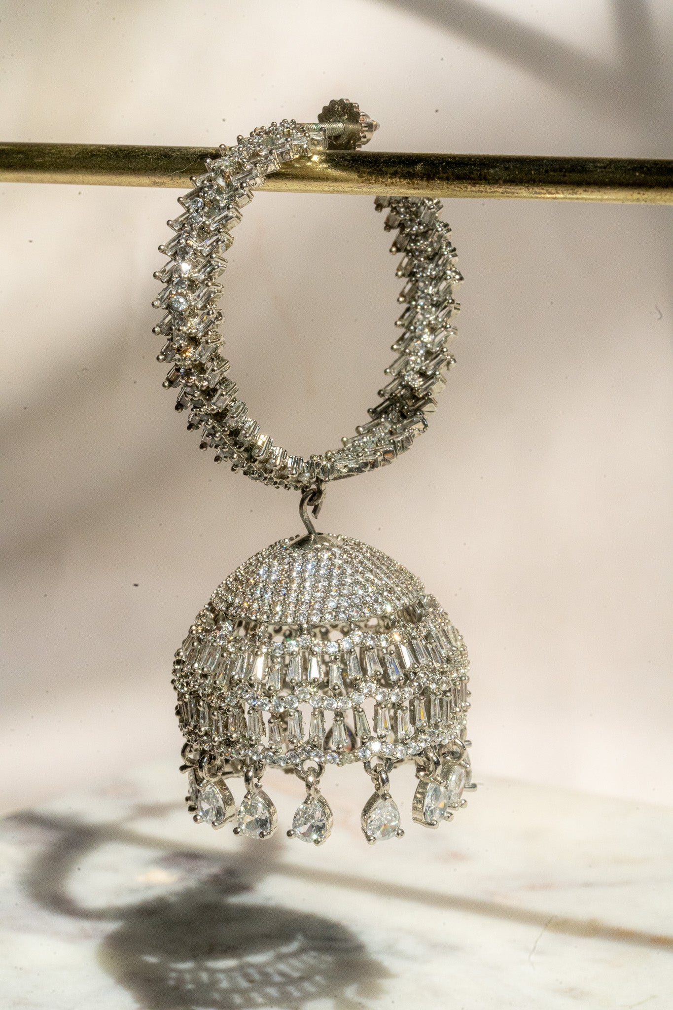 Elham - Rhodium Plated Hoop Style Dangling AD Jhumka Earrings