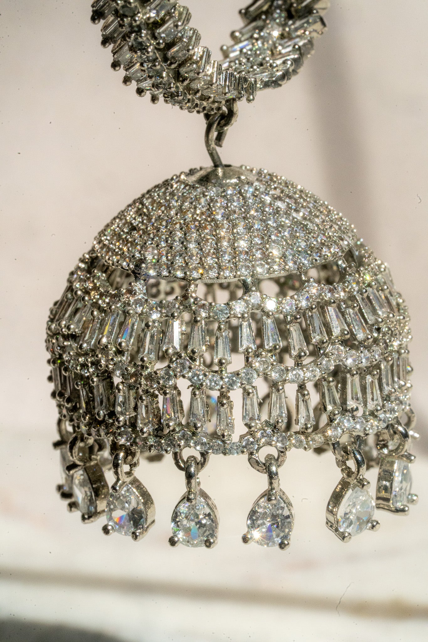 Elham - Rhodium Plated Hoop Style Dangling AD Jhumka Earrings