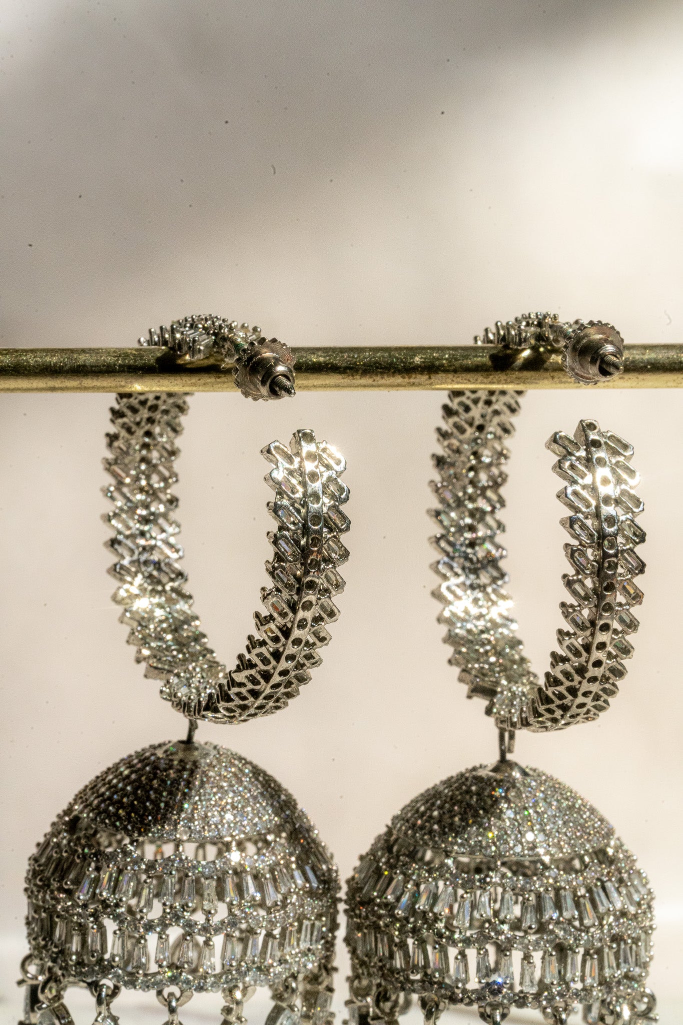 Elham - Rhodium Plated Hoop Style Dangling AD Jhumka Earrings