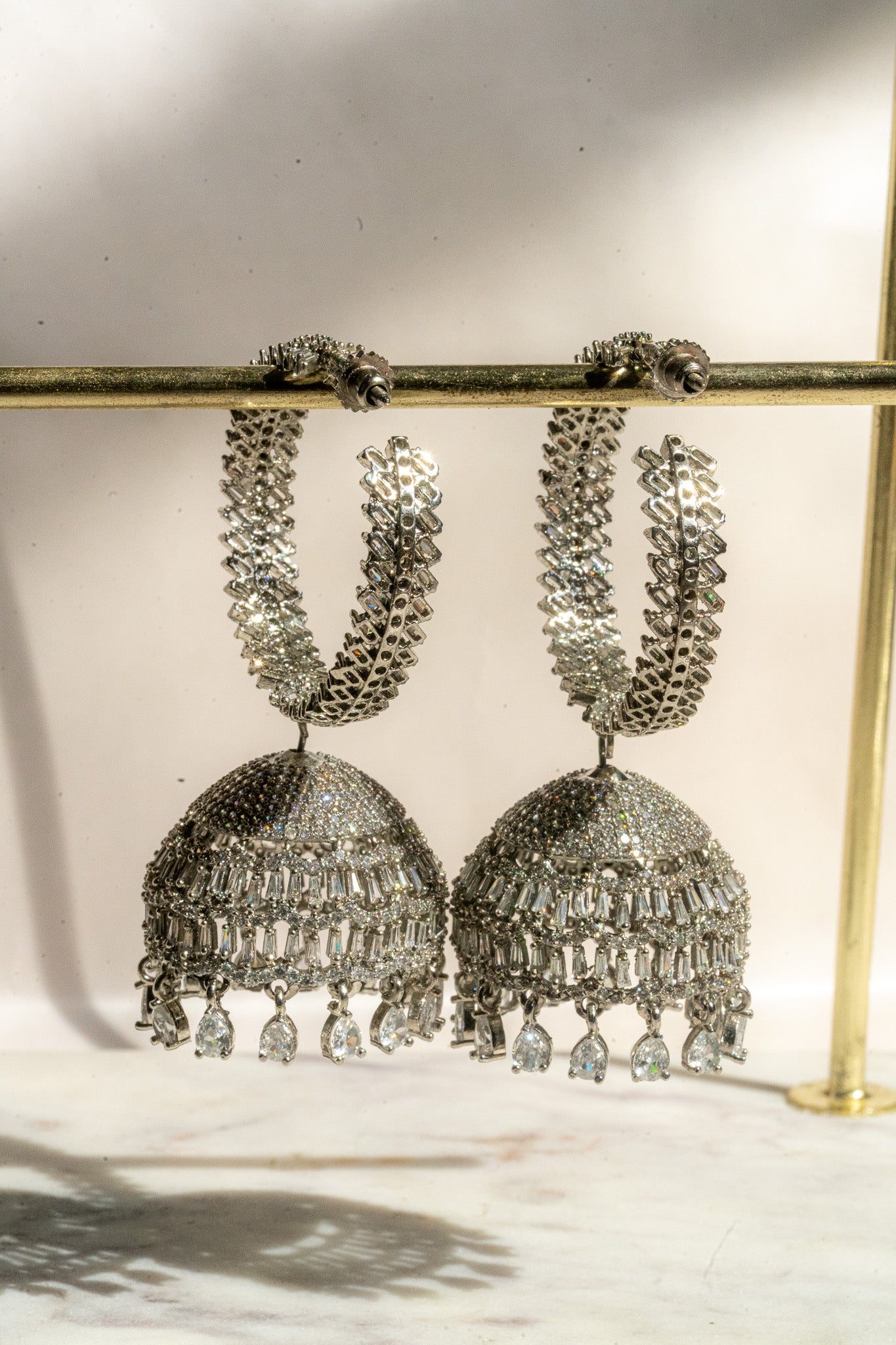 Elham - Rhodium Plated Hoop Style Dangling AD Jhumka Earrings
