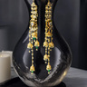Gold-plated long jhumka earrings with moissanite polki stones, pearls, and green enamel - Indian earrings from Inaury