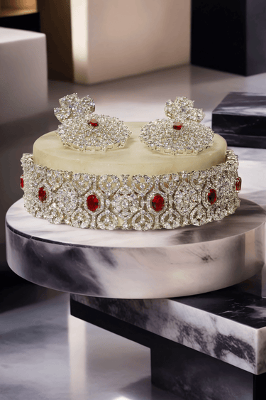 Priya Diamante Bridal Set - Rhodium-plated silver with maroon accents, including cascading necklace and intricate floral choker with matching earrings.