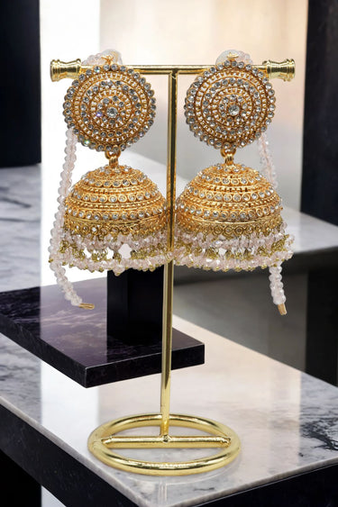 Gold Tabiha Jhumka Earrings with white crystal fringe, handcrafted for bridal and festive jewelry collections.