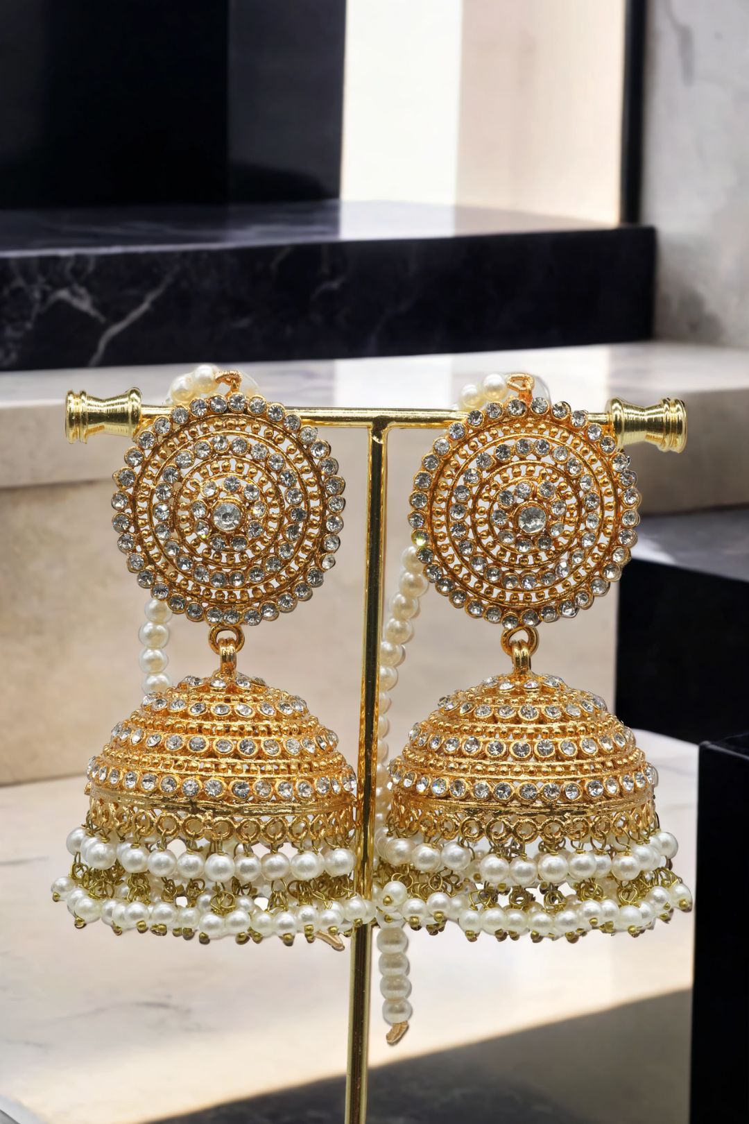 Gold Tabiha Jhumka Earrings with pearl drops, part of the elegant handcrafted Pakistani jewelry set.