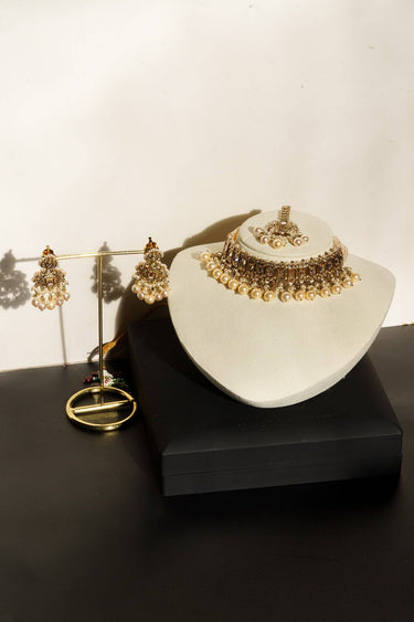 Maha Antique Gold Choker Necklace Set with earrings on display stand