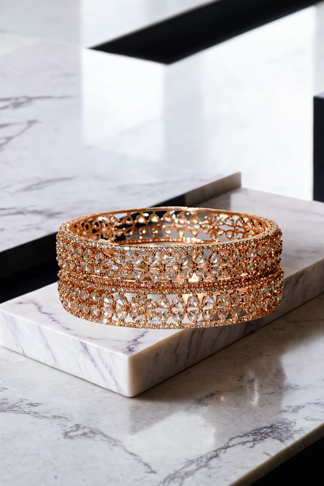 Close-up of Myra Bangles Set - Rose Gold AD Bangles with floral petal pattern and shimmering white stones, ideal for festive wear.
