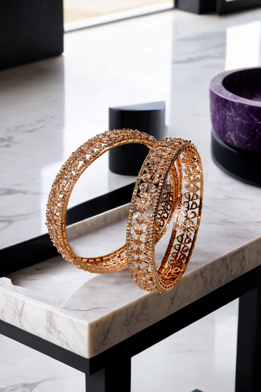 Luxurious Myra Rose Gold AD Bangles with floral petal motifs and white AD stone rims, perfect for elegant occasions.
