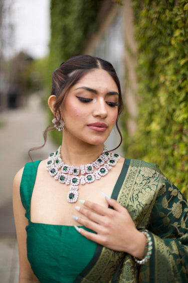 Tinzina Wide Diamante Necklace Set showcased outdoors