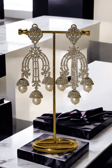 Raina - Pearl Jhumka Earrings with pavé-set white stones and faux pearls – Indian jewelry for bridal and festive wear.
