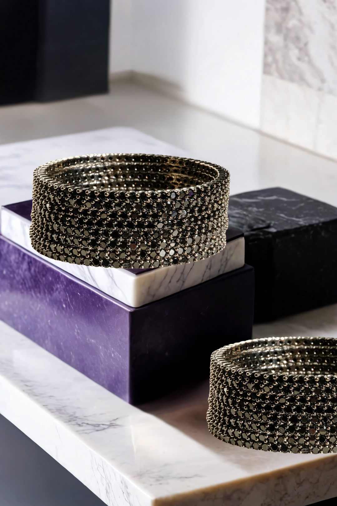 Simran Bangles - Set of 8 Choori Style Black Plated Bangles with Black Stones by Inaury, displayed on a marble surface with luxurious black detailing.