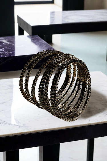 Simran Bangles - Set of 8 Choori Style Black Plated Bangles with Black Stones by Inaury, displayed on a marble surface with luxurious black detailing.