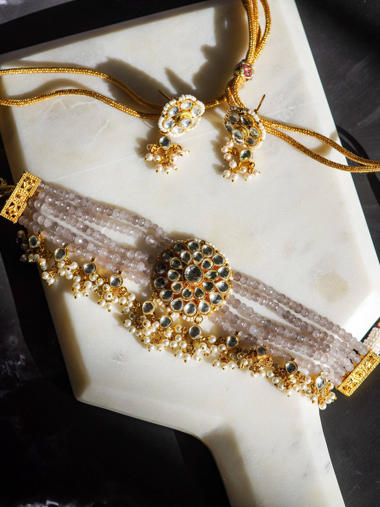 Aaina gold-plated kundan choker necklace set with gray beads and floral stud earrings – Indian jewelry from Inaury