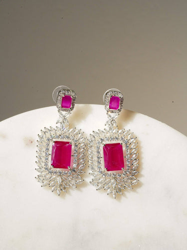 Amisha Triple Layer Diamante Accent AD Necklace Set in gold or rhodium-plated silver finish with color options of silver & sapphire blue, silver & green, gold & green, and silver & ruby, featuring floral and cushion cut stone patterns with matching earrings.