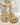 Gold-plated kundan jhumka earrings with sculpted bird motif and pearl danglings – Inaury.com