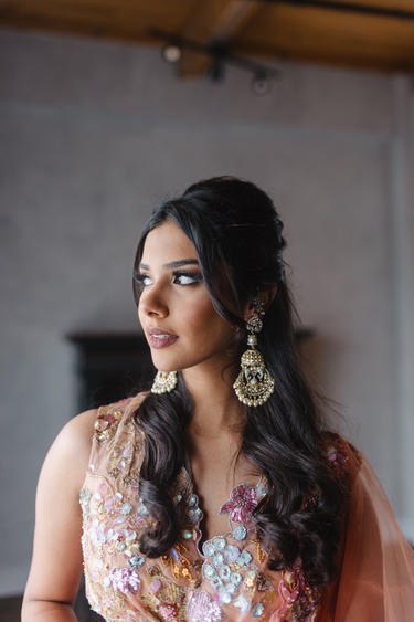 Gold-plated kundan jhumka earrings with sculpted bird motif and pearl danglings – Inaury.com