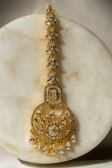 Gold-plated floral maang tikka with American Diamonds in white and pink from Inaury