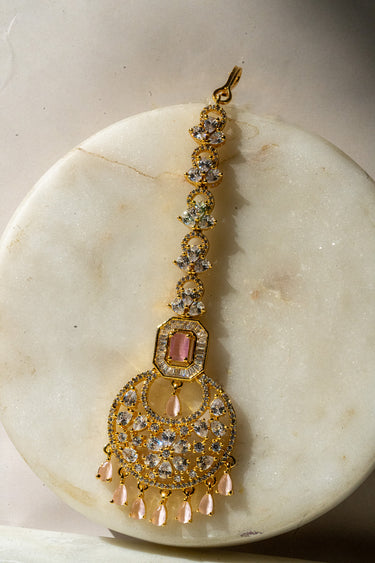 Gold-plated floral maang tikka with American Diamonds in white and pink from Inaury